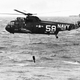 A US Navy SH-3A Sea King from Helicopter Anti-Submarine Squadron 2 (HS-2) “Golden Falcons” deploys its AN/AQS-13 dipping sonar. Note the aircraft carrier on the horizon. (US Navy)